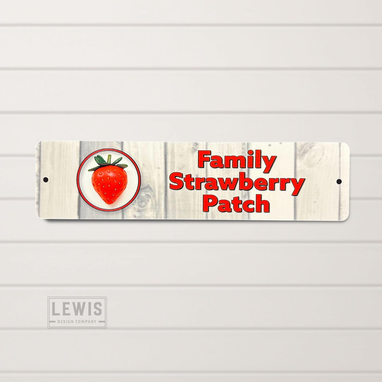 Wooden sign with a strawberry illustration and 'Family Strawberry Patch' text on a white background.