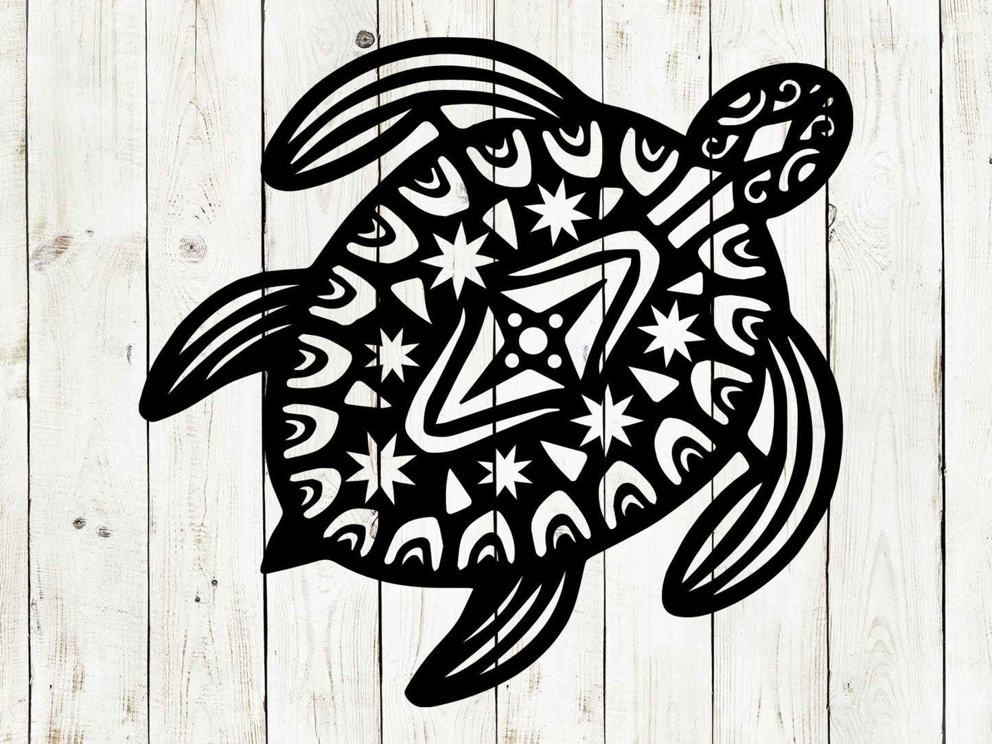 Black turtle design with white patterns on a wooden background