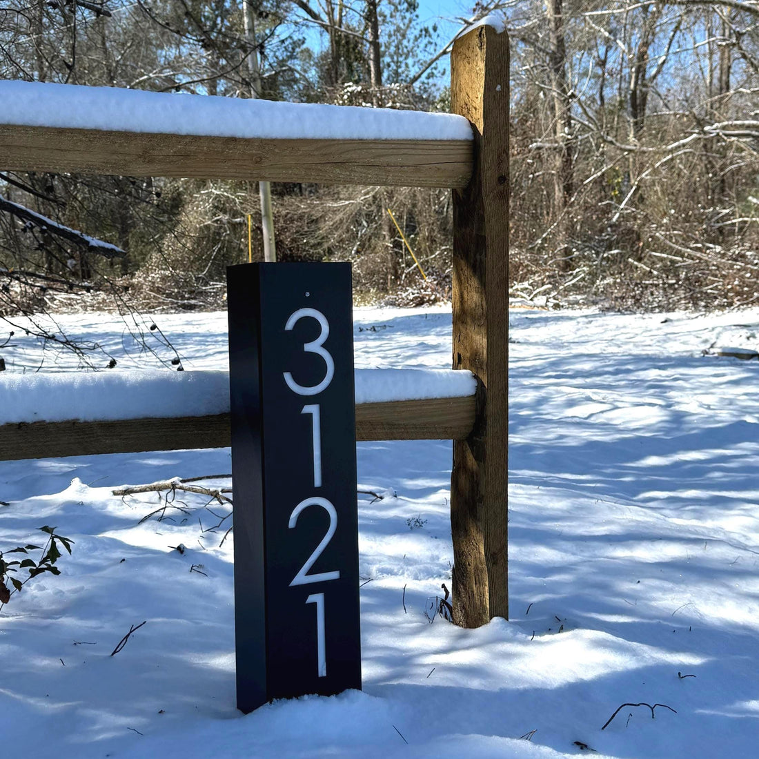 Steel address post in the snow