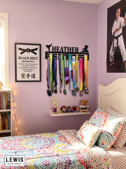 Medal holder with medals and ribbons on a wall, branded 'LEWIS Design Company'. Female Karate Medal and Award Display