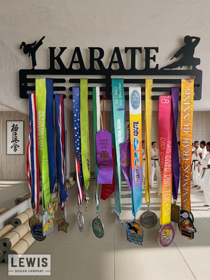 Medal holder with medals and ribbons on a wall, branded 'LEWIS Design Company'. Female Karate Medal and Award Display