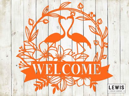Decorative 'Welcome' sign with flamingo design on a wooden background, featuring the brand 'LEWIS Design Company'.