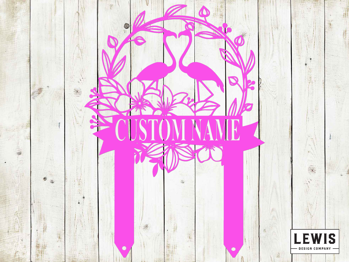 Pink decorative sign with flamingo design and 'Custom Name' text on a wooden background, featuring the Lewis Design Company logo.