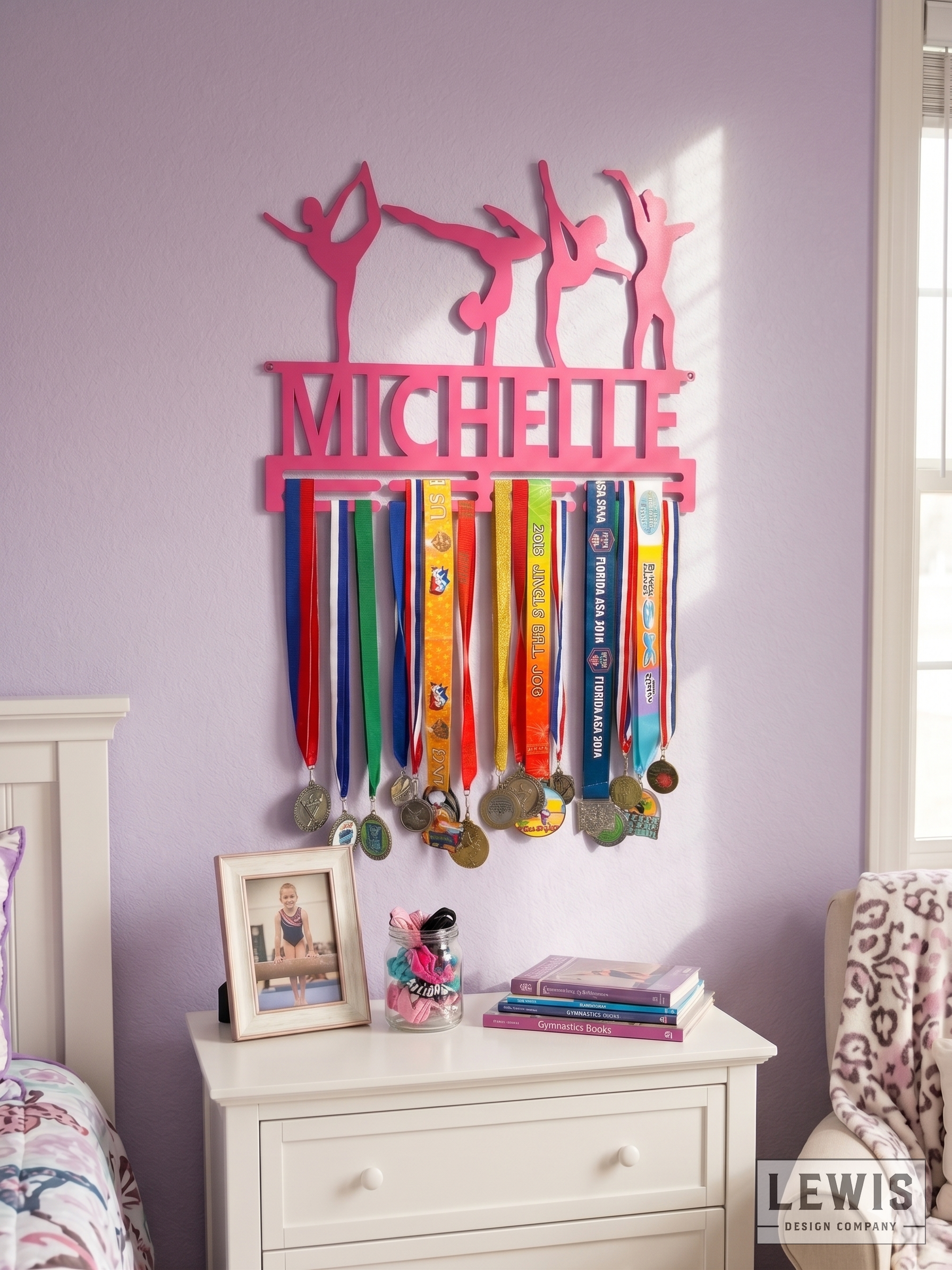 Pink medal holder with medals hanging on a wall in a bedroom.