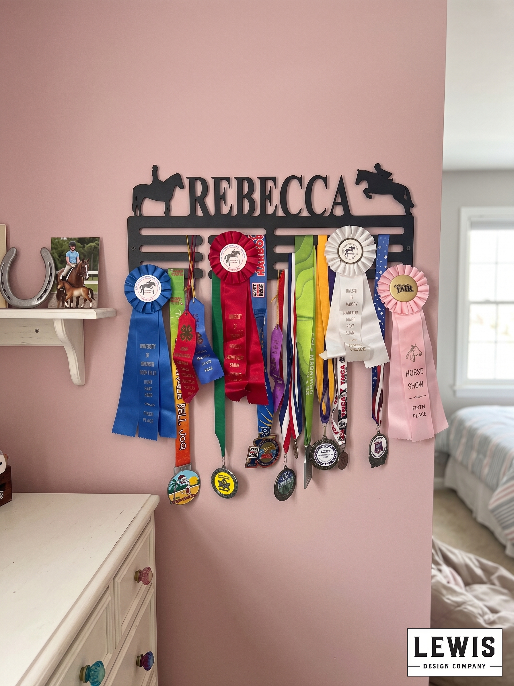 Horse-themed ribbon holder with colorful ribbons on a pink wall, featuring the name 'Rebecca'.