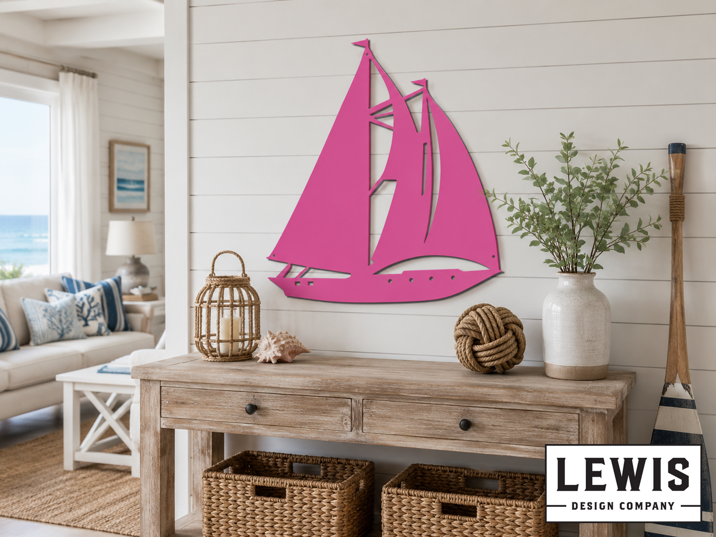 Living room with pink sailboat wall art, wooden console table, and decorative items.