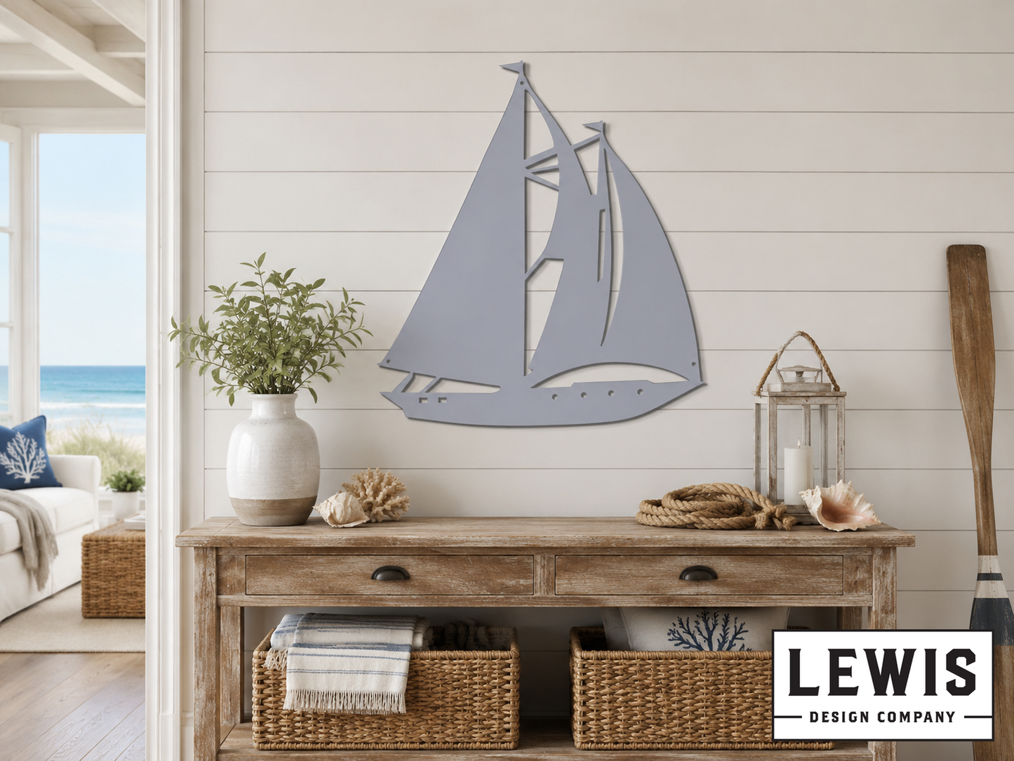Decorative sailboat wall art above a wooden console table with baskets and a lantern.