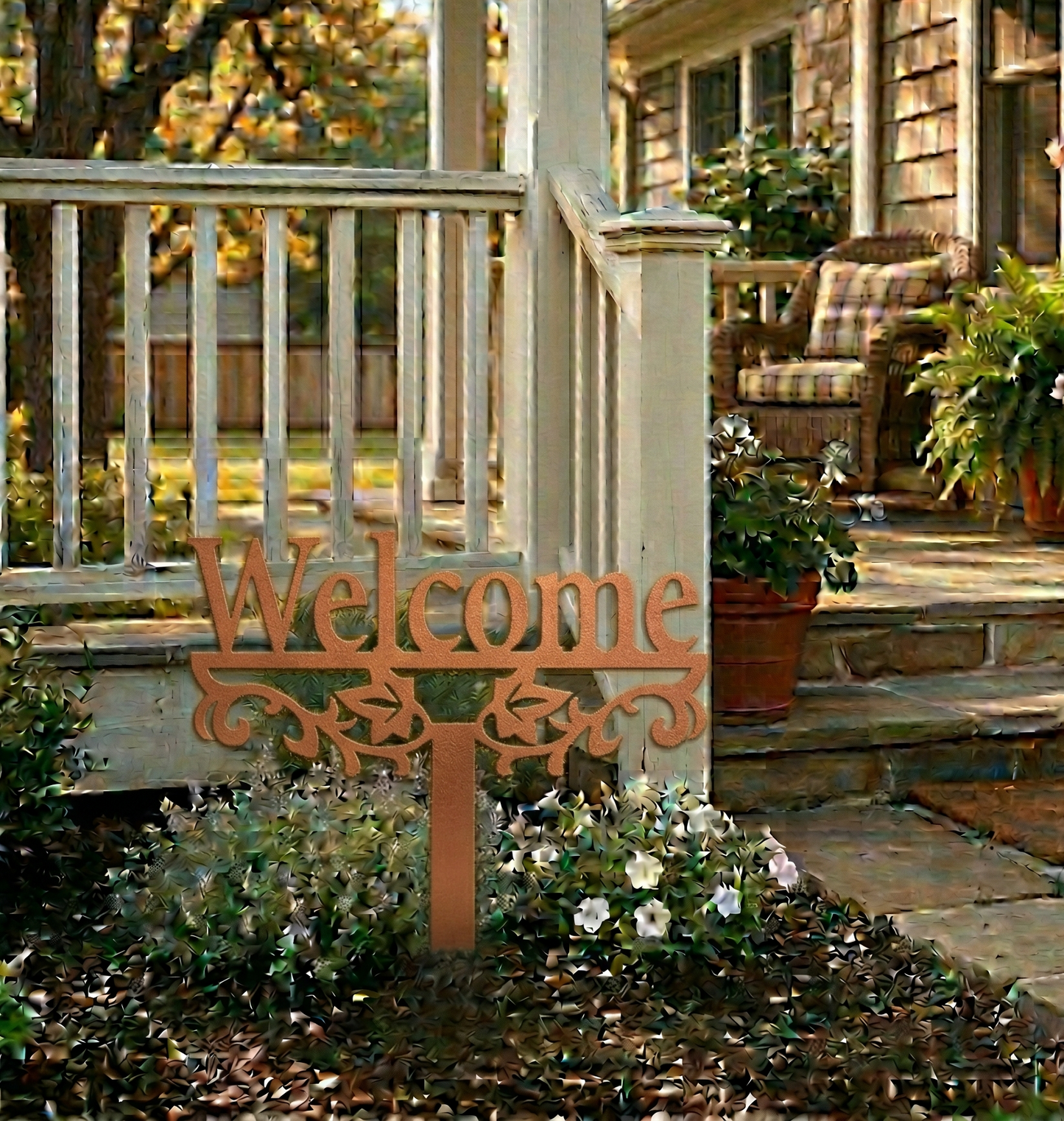 Decorative 'Welcome' sign on a garden path with a house in the background