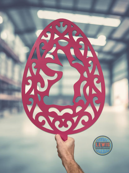 Easter Bunny Decorative pink metal wall art with intricate patterns held by a hand in an indoor setting.