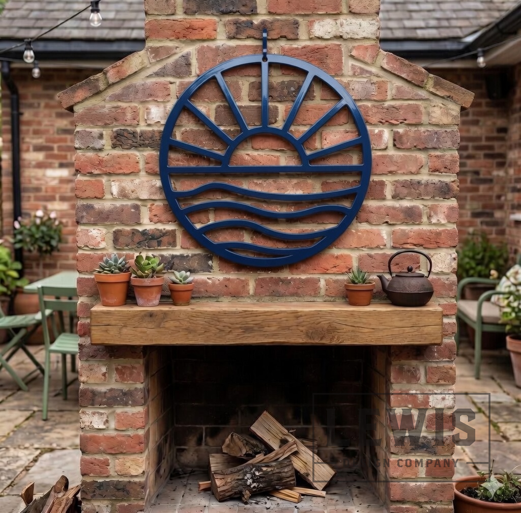 Navy blue Sun and Waves metal wall art mounted above brick outdoor fireplace for patio and backyard decor