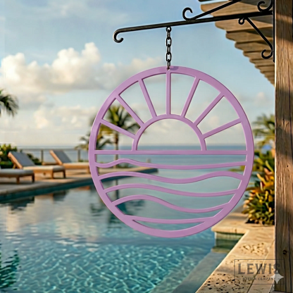 Pastel purple Sun and Waves metal wall art hanging poolside at coastal beach house with palm trees and ocean view