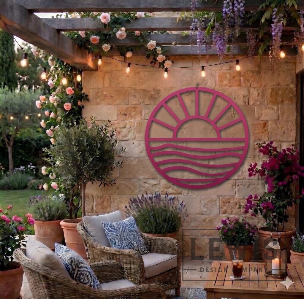 Pink Sun and Waves metal wall art hanging on stone patio wall with cozy outdoor beach house decor